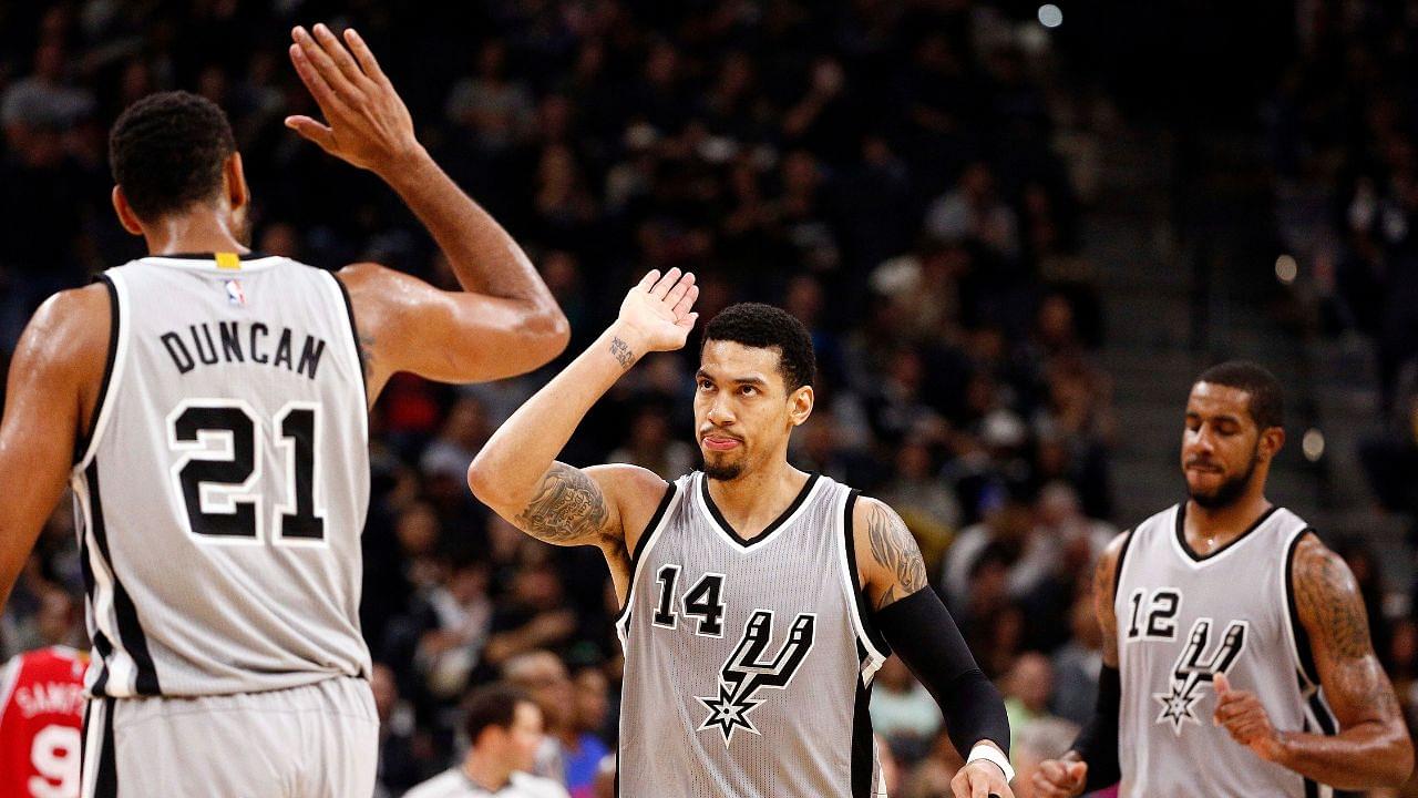 San Antonio Spurs shooting guard Danny Green (14) celebrates with power forward Tim Duncan (21) after hitting a three point shot during the second half against the Philadelphia 76ers at AT&T Center.