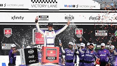 NASCAR Cup Series driver Denny Hamlin (11) celebrates with his team after winning the FireKeepers Casino 400 at Michigan International Speedway.