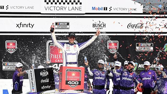 NASCAR Cup Series driver Denny Hamlin (11) celebrates with his team after winning the FireKeepers Casino 400 at Michigan International Speedway.