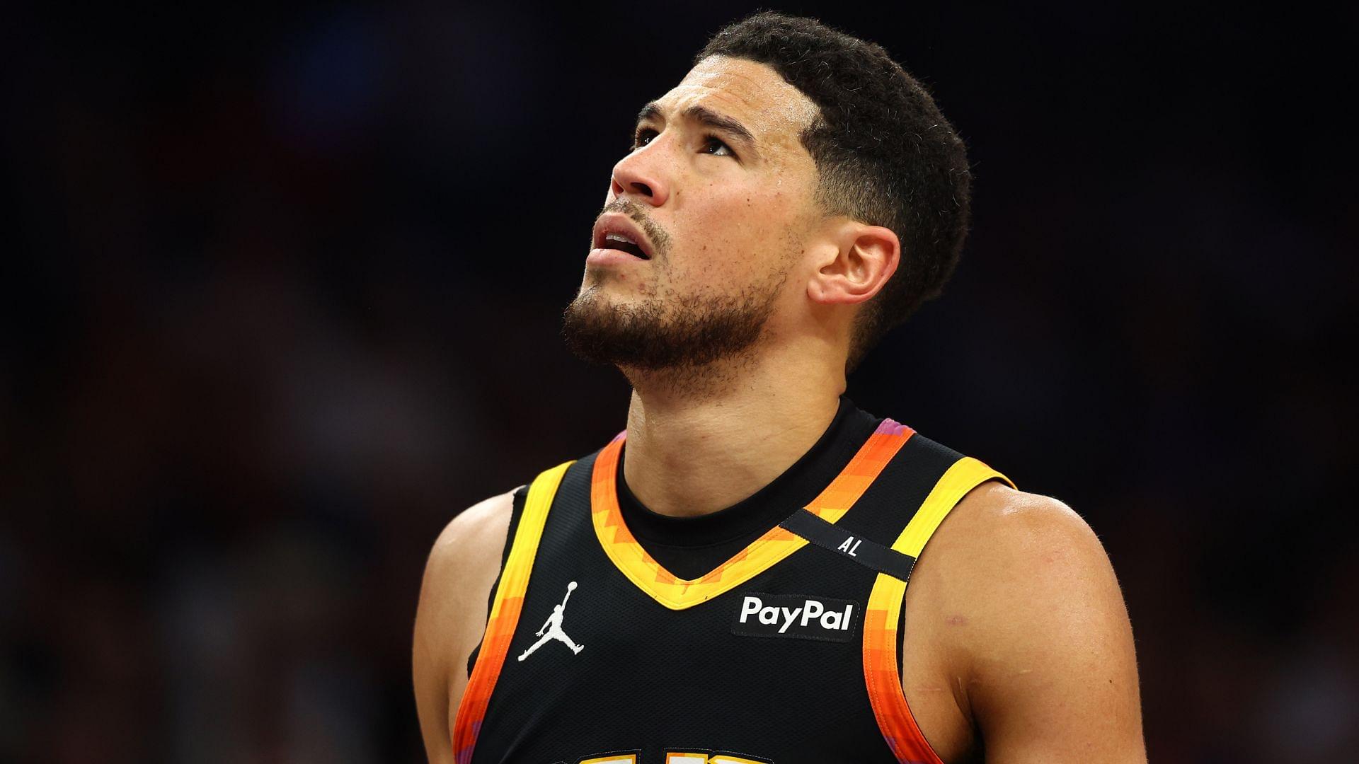 Apr 9, 2025; Phoenix, Arizona, USA; Phoenix Suns guard Devin Booker (1) reacts after a play against the Oklahoma City Thunder during the first half at Footprint Center.