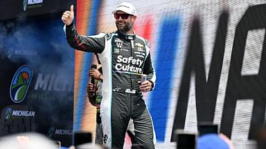 NASCAR Cup Series driver Shane van Gisbergen (88) greets the crowd during driver introductions before the start of the FireKeepers Casino 400 at Michigan International Speedway.