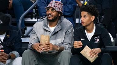 Carmelo Anthony and his son, Kiyan, watch the Don Bosco Prep Ironmen compete against the McEachern Indians in a game during the 50th annual City of Palms Classic at Suncoast Credit Union Arena in Fort Myers on Tuesday, Dec. 19, 2023. Kiyan Anthony and the Long Island Luthern Crusaders defeated Westminster Academy earlier in the day.