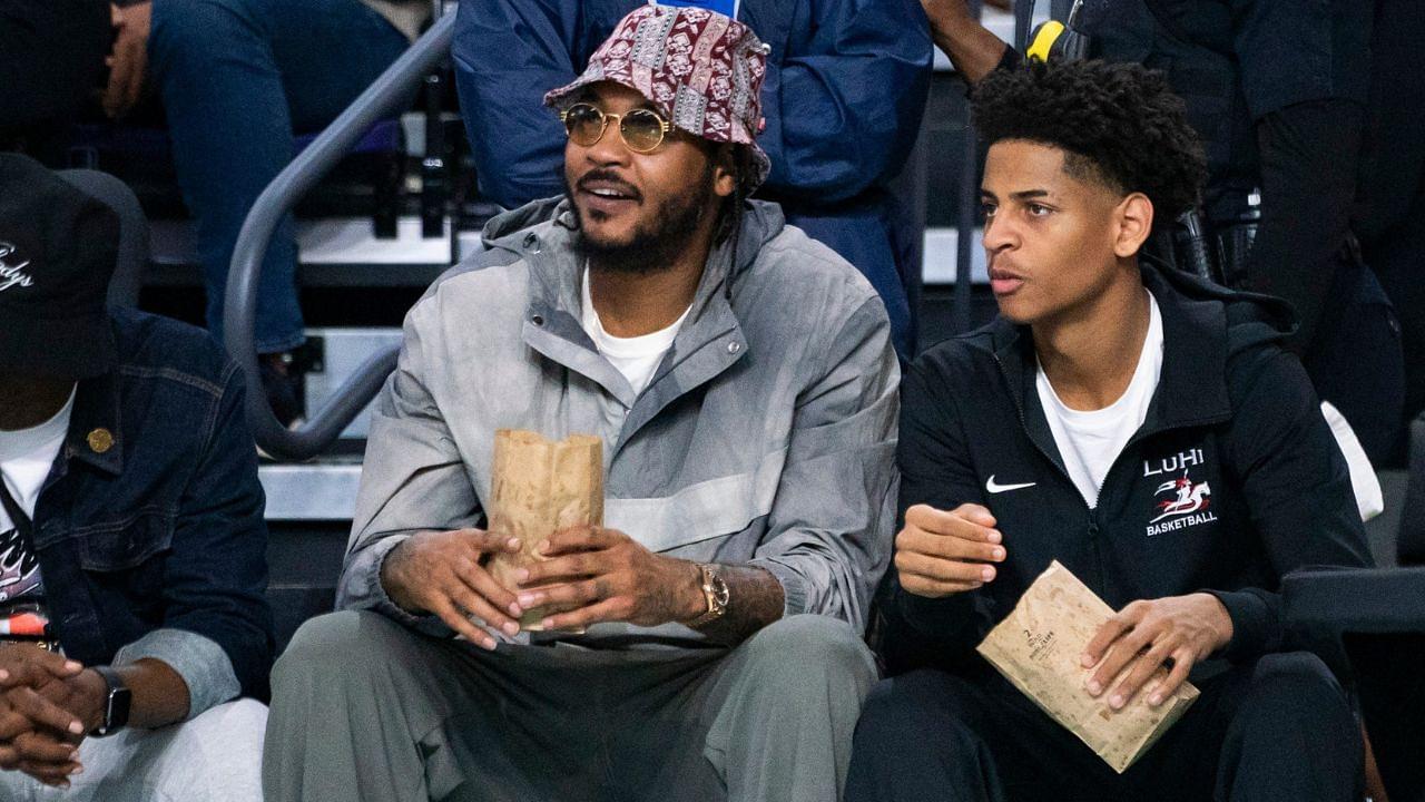 Carmelo Anthony and his son, Kiyan, watch the Don Bosco Prep Ironmen compete against the McEachern Indians in a game during the 50th annual City of Palms Classic at Suncoast Credit Union Arena in Fort Myers on Tuesday, Dec. 19, 2023. Kiyan Anthony and the Long Island Luthern Crusaders defeated Westminster Academy earlier in the day.
