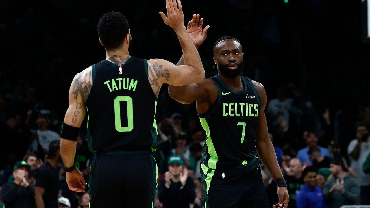 Boston Celtics guard Jaylen Brown (7) high fives forward Jayson Tatum (0) after the Cleveland Cavaliers called a timeout during the first quarter at TD Garden