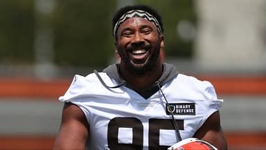 Browns defensive end Myles Garrett has a moment with defensive line coach Jacques Cesaire during practice at minicamp, Tuesday, June 10, 2025, in Berea.