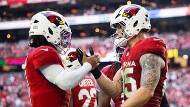 Arizona Cardinals quarterback Kyler Murray (1) celebrates a touchdown with tight end Trey McBride (85) against the San Francisco 49ers at State Farm Stadium.