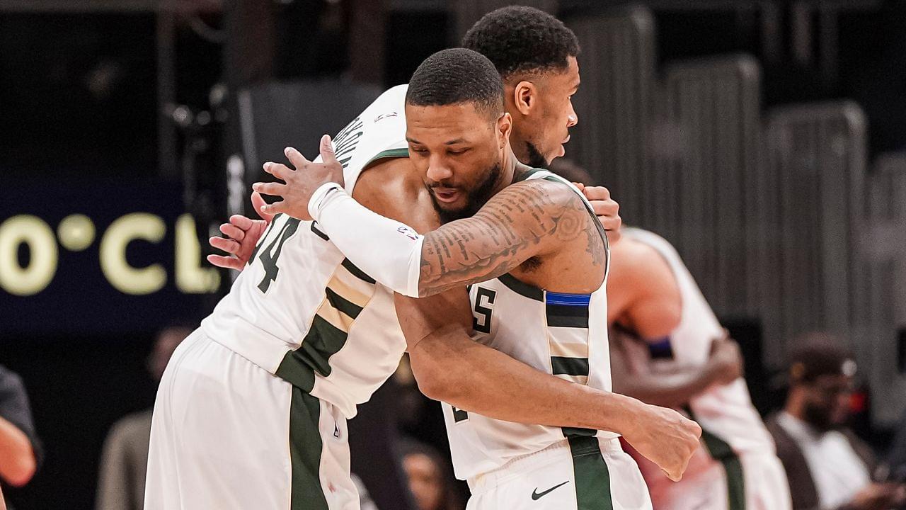 Milwaukee Bucks forward Giannis Antetokounmpo (34) and guard Damian Lillard (0) react after defeating the Atlanta Hawks at State Farm Arena.