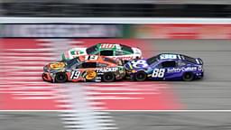 NASCAR Cup Series drivers Chase Briscoe (19) Ryan Preece (60) and Shane van Gisbergen (88) race bumper to bumper down the main straightaway during stage three of the FireKeepers Casino 400 at Michigan International Speedway.