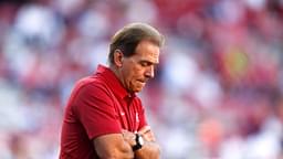 Coach Nick Saban watches his Crimson Tide players warm up before Alabama's 49-30 win over the Razorbacks in Fayetteville Saturday, October 8, 2016.