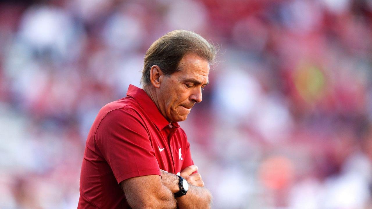Coach Nick Saban watches his Crimson Tide players warm up before Alabama's 49-30 win over the Razorbacks in Fayetteville Saturday, October 8, 2016.