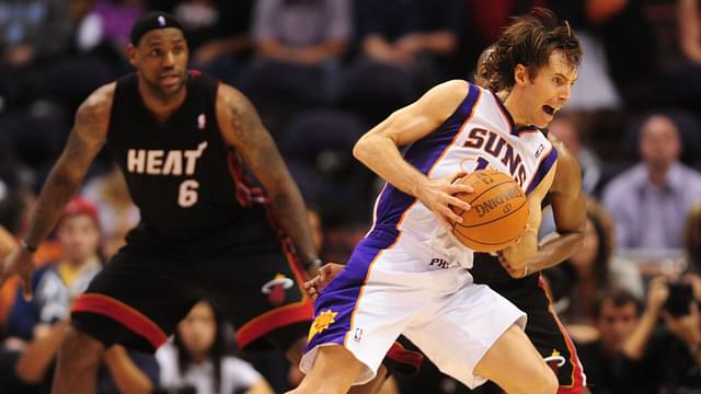 Dec. 23, 2010; Phoenix, AZ, USA; Phoenix Suns guard (13) Steve Nash drives to the basket as Miami Heat forward LeBron James looks on at the US Airways Center. Miami defeated Phoenix 95-83.