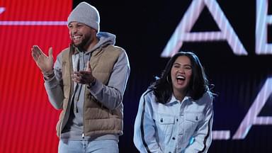 Golden State Warriors players Stephen Curry and wife Ayesha Curry react on stage during the 2022 NBA All-Star Saturday Night at Rocket Mortgage Field House.