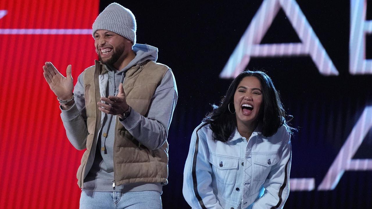 Golden State Warriors players Stephen Curry and wife Ayesha Curry react on stage during the 2022 NBA All-Star Saturday Night at Rocket Mortgage Field House.