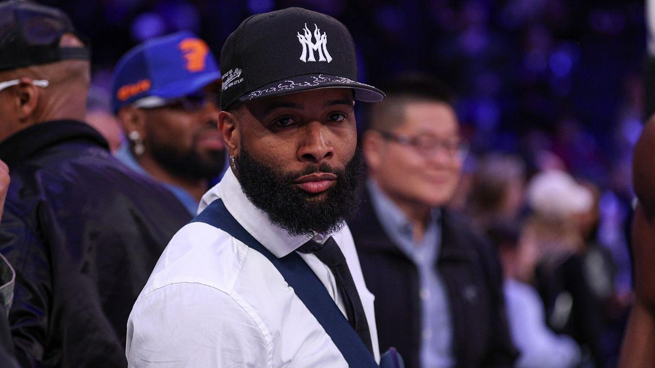 NFL wide receiver Odell Beckham Jr. sits courtside during the second half of the NBA game between the New York Knicks and the Phoenix Suns at Madison Square Garden.