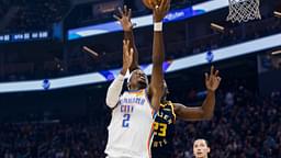 Nov 27, 2024; San Francisco, California, USA; Oklahoma City Thunder guard Shai Gilgeous-Alexander (2) shoots as Golden State Warriors forward Draymond Green (23) defends during the first half at Chase Center
