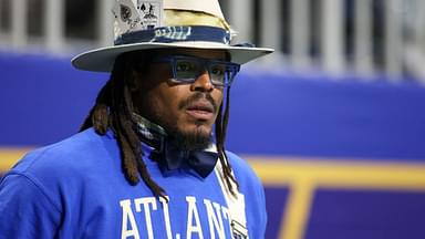 Former NFL quarterback Cam Newton watches a game between the Howard Bison and Florida A&M Rattlers in the first half at Mercedes-Benz Stadium.“They’re Playing Video Games All Day”: Cam Newton Blasts Gen Z Players Like Cam Skattebo for Not Recognizing NFL Legends