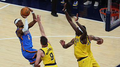 Oklahoma City Thunder guard Shai Gilgeous-Alexander (2) drives to the hoop past Indiana Pacers guard T.J. McConnell (9) during the third quarter of game four of the 2025 NBA Finals