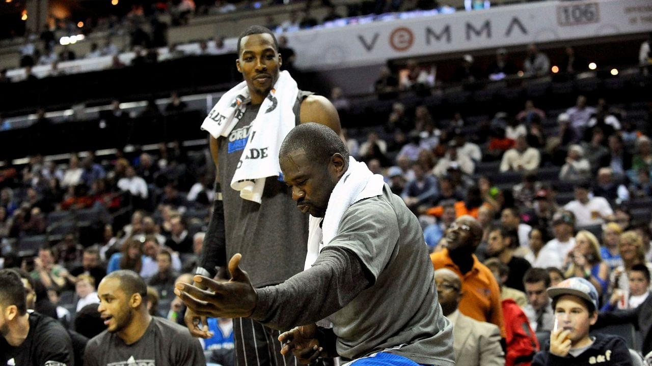 Orlando Magic guard Jason Richardson (23) celebrates his team scoring as center Dwight Howard looks on during the game against the Charlotte Bobcats at Time Warner Cable Arena.