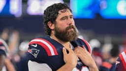 New England Patriots center David Andrews (60) watches from the sideline during the first half against the Carolina Panthers at Gillette Stadium.