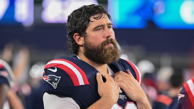 New England Patriots center David Andrews (60) watches from the sideline during the first half against the Carolina Panthers at Gillette Stadium.