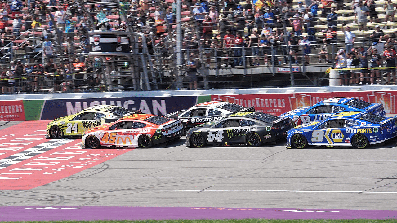 William Byron and Tyler Reddick lead the re-start during overtime of the FireKeepers Casino 400 at Michigan International Speedway.