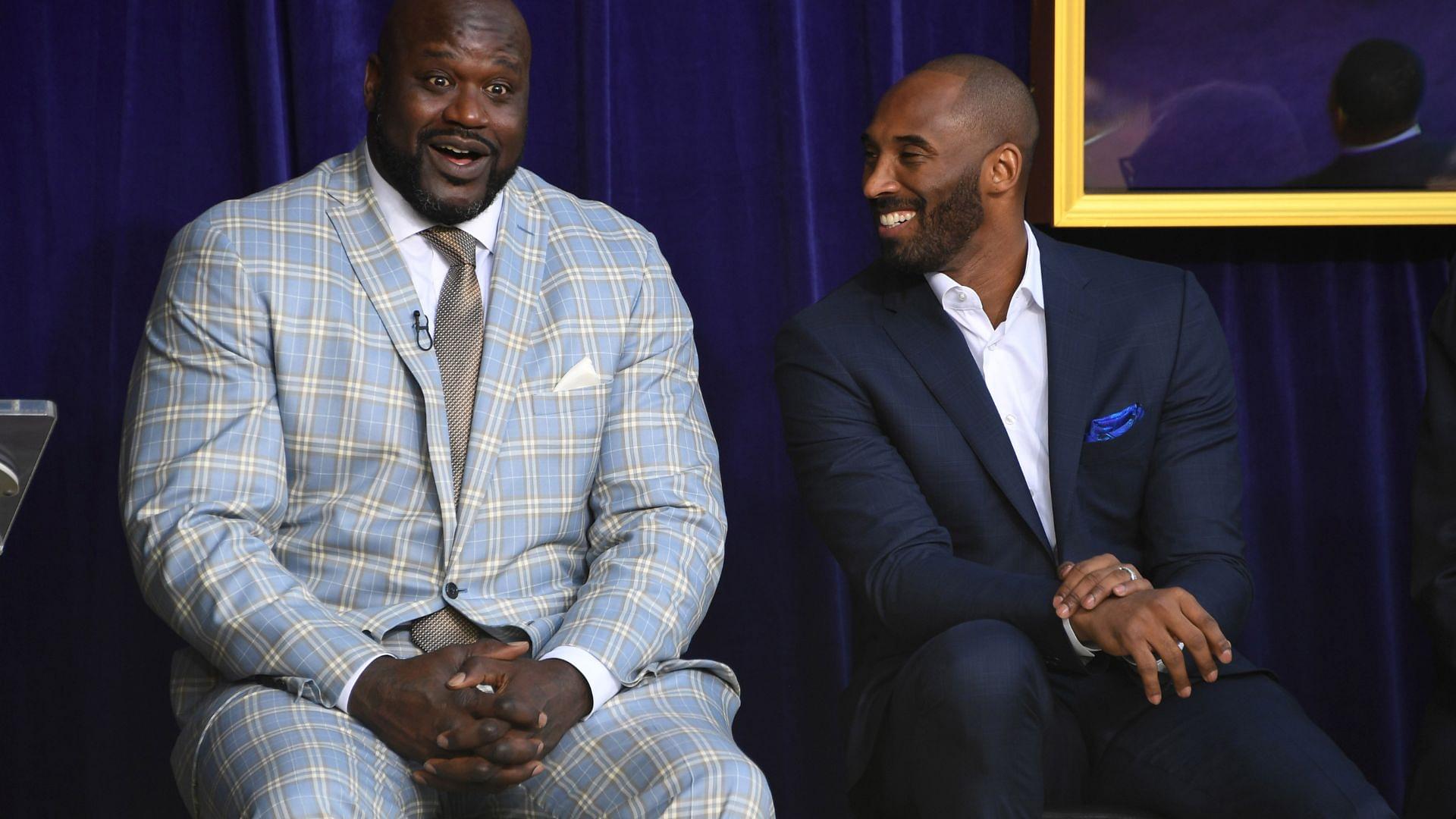 Mar 24, 2017; Los Angeles, CA, USA; Los Angeles Lakers former center Shaquille O'Neal (left) and guard Kobe Bryant react during ceremony to unveil statue of O'Neal at Staples Center.