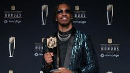 Washington Commanders quarterback Jayden Daniels poses with the Offensive Rookie of the Year award during Super Bowl LIX NFL Honors at Saenger Theatre.
