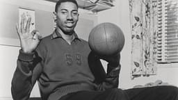 Vintage 1960 s capture of Wilt Chamberlain smiling while spinning a basketball