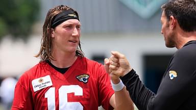 Jacksonville Jaguars quarterback Trevor Lawrence (16) fist bumps executive vice president of football operations Tony Boselli during the first organized team activity at Miller Electric Center Monday, May 19, 2025 in Jacksonville, Fla.
