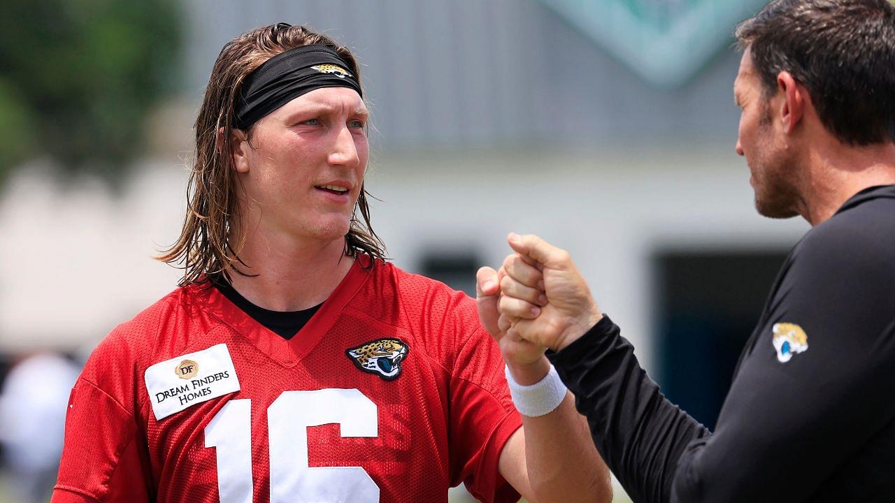 Jacksonville Jaguars quarterback Trevor Lawrence (16) fist bumps executive vice president of football operations Tony Boselli during the first organized team activity at Miller Electric Center Monday, May 19, 2025 in Jacksonville, Fla.