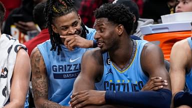 Mar 26, 2023; Atlanta, Georgia, USA; Memphis Grizzlies guard Ja Morant (12) and forward Jaren Jackson Jr. (13) react ons the bench during the game against the Atlanta Hawks during the second half at State Farm Arena