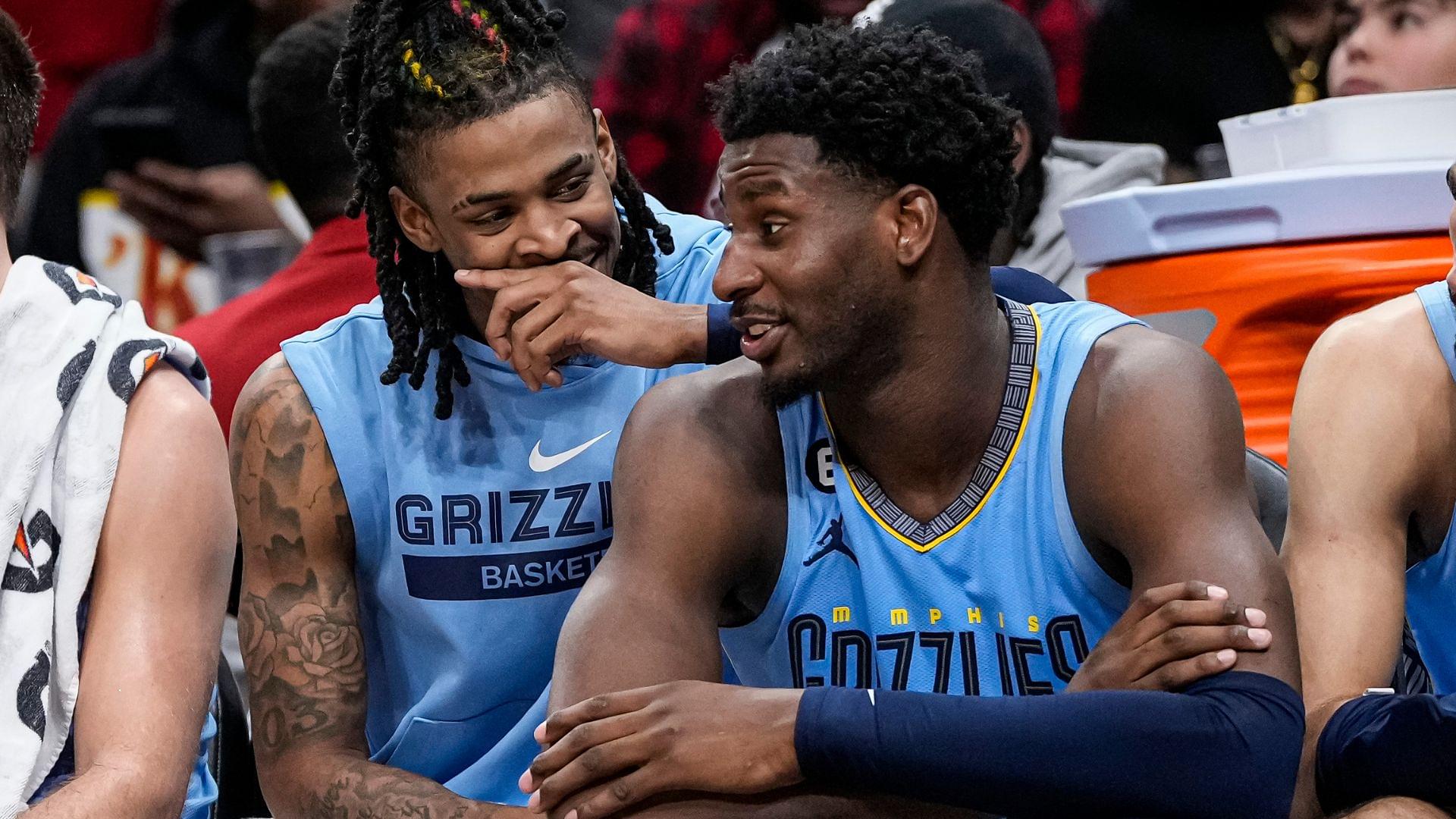 Mar 26, 2023; Atlanta, Georgia, USA; Memphis Grizzlies guard Ja Morant (12) and forward Jaren Jackson Jr. (13) react ons the bench during the game against the Atlanta Hawks during the second half at State Farm Arena