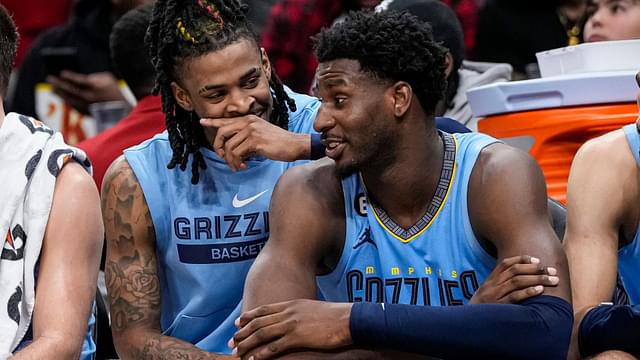 Mar 26, 2023; Atlanta, Georgia, USA; Memphis Grizzlies guard Ja Morant (12) and forward Jaren Jackson Jr. (13) react ons the bench during the game against the Atlanta Hawks during the second half at State Farm Arena