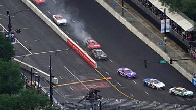NASCAR Cup Series driver Chase Briscoe (14) shows smoke as he races along Grant Park during the Grant Park 220 of the Chicago Street Race viewed from the NEMA Chicago buliding.