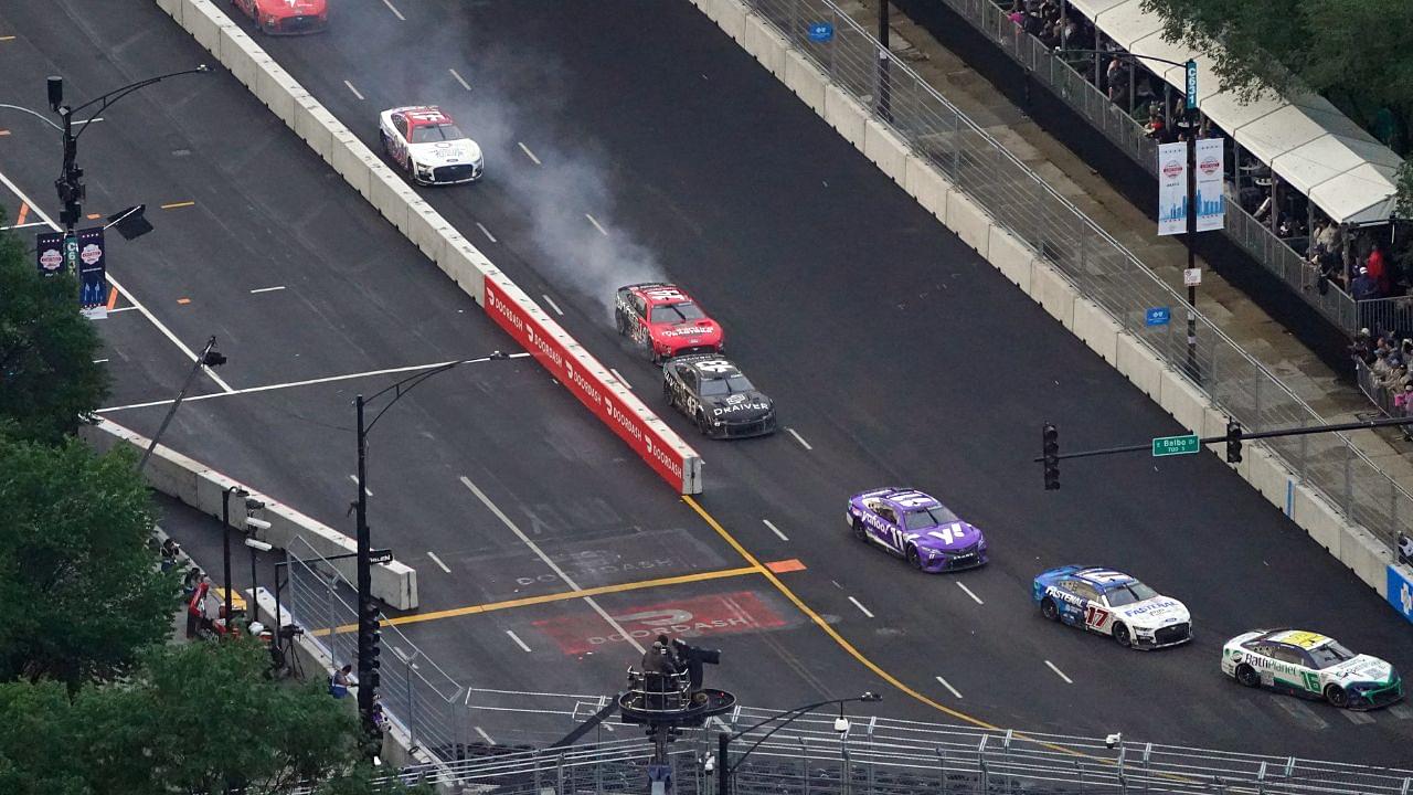 NASCAR Cup Series driver Chase Briscoe (14) shows smoke as he races along Grant Park during the Grant Park 220 of the Chicago Street Race viewed from the NEMA Chicago buliding.