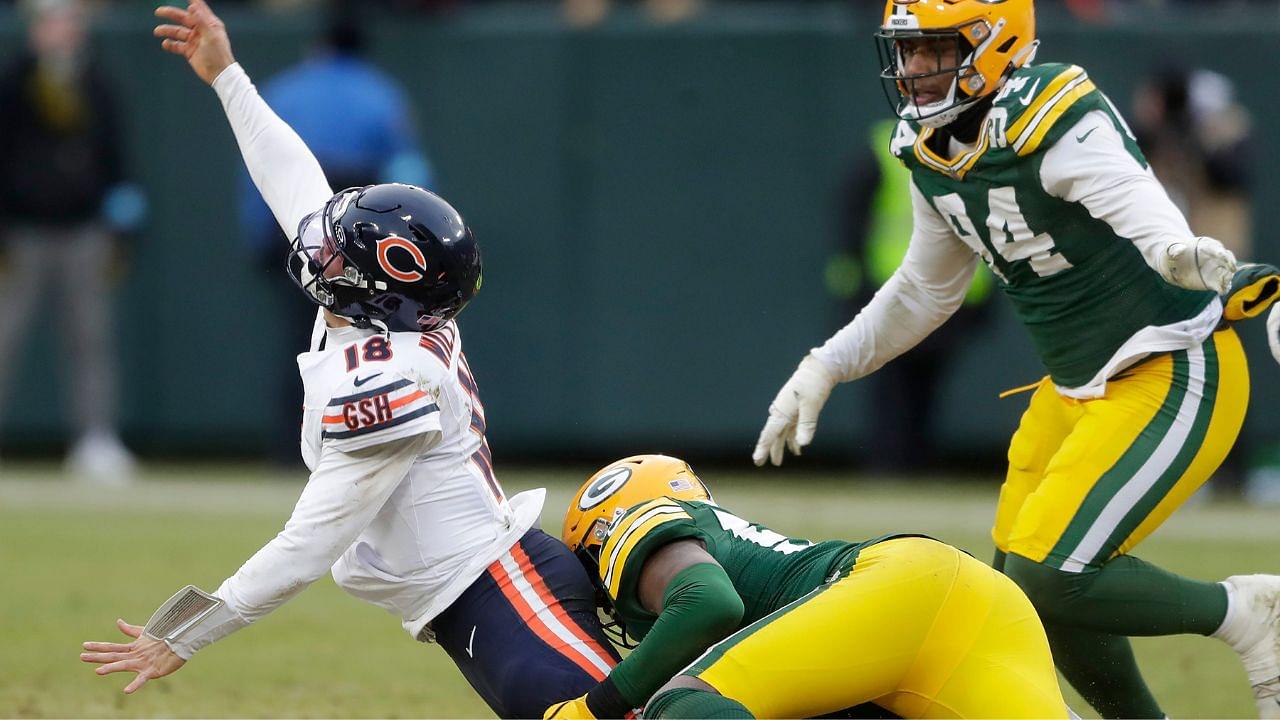 Green Bay Packers linebacker Edgerrin Cooper (56) wraps up Chicago Bears quarterback Caleb Williams (18) on Sunday, January 5, 2024 at Lambeau Field in Green Bay, Wis. The Bears defeated the Packers 24-22.