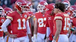 Dec 10, 2017; Kansas City, MO, USA; Kansas City Chiefs quarterback Alex Smith (11) talks with quarterback Patrick Mahomes (15) during the first half against the Oakland Raiders at Arrowhead Stadium.