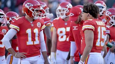 Dec 10, 2017; Kansas City, MO, USA; Kansas City Chiefs quarterback Alex Smith (11) talks with quarterback Patrick Mahomes (15) during the first half against the Oakland Raiders at Arrowhead Stadium.