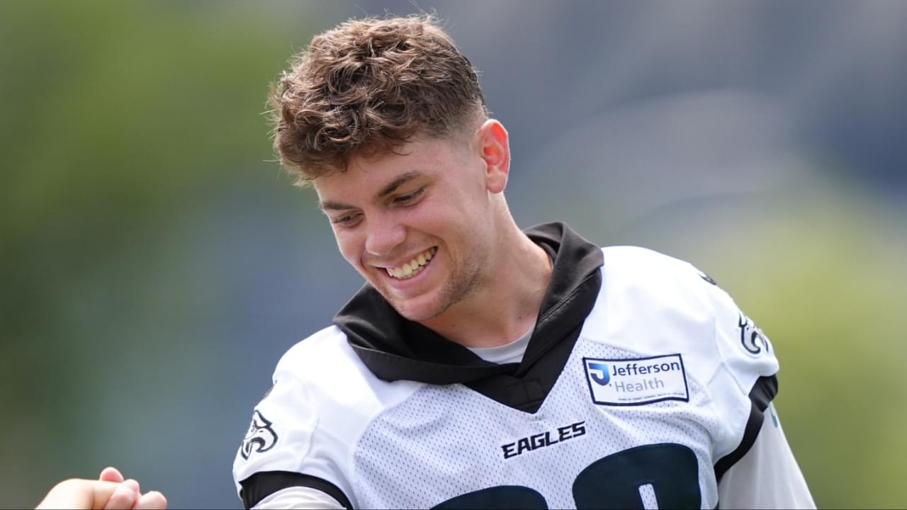 Philadelphia Eagles defensive back Cooper DeJean (33) plays with the children of running back Saquon Barkley during training camp at NovaCare Complex.