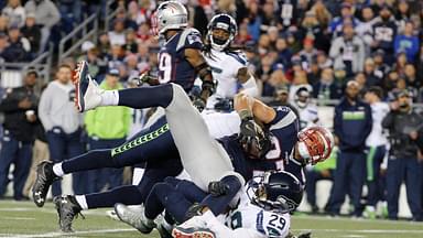 New England Patriots tight end Rob Gronkowski (87) dives forward against Seattle Seahawks free safety Earl Thomas (29) and strong safety Kam Chancellor (31) and in the second quarter at Gillette Stadium.
