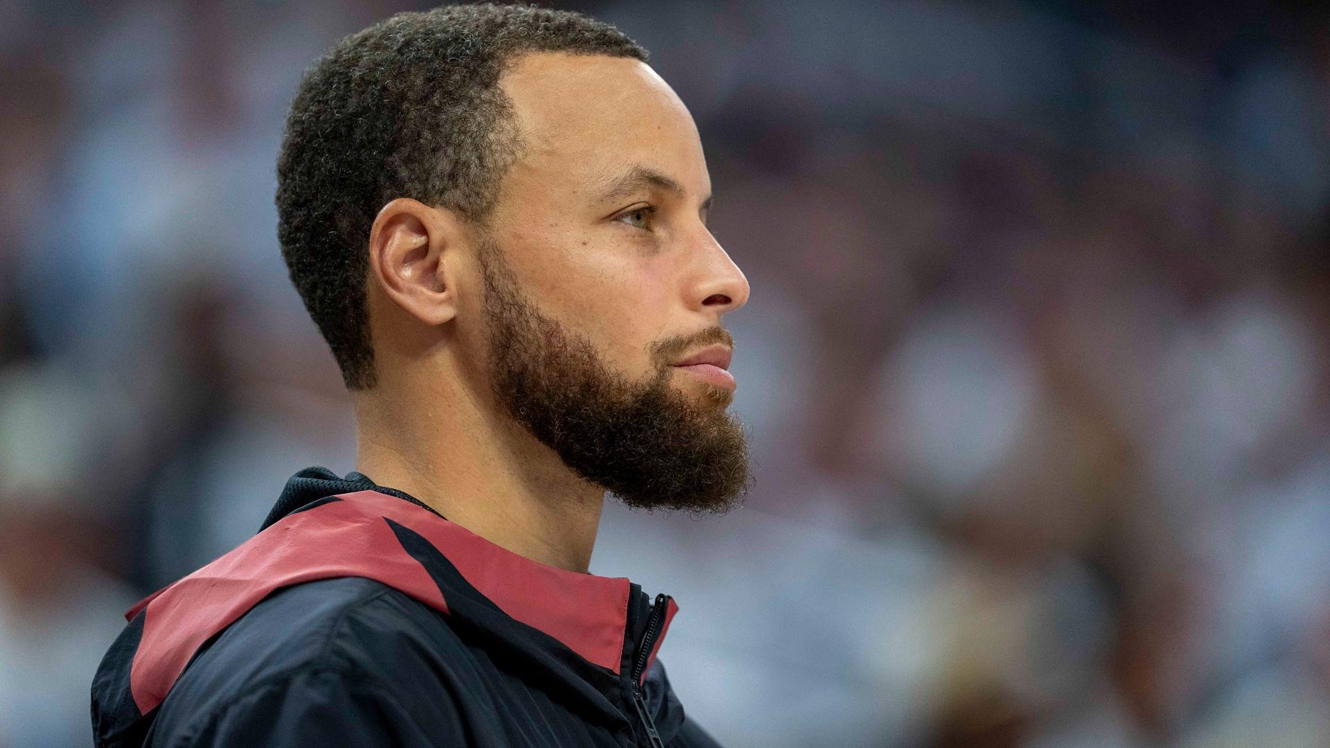 May 8, 2025; Minneapolis, Minnesota, USA; Golden State Warriors guard Stephen Curry (30) looks on from the bench against the Minnesota Timberwolves in the second half during game two of the second round for the 2025 NBA Playoffs at Target Center