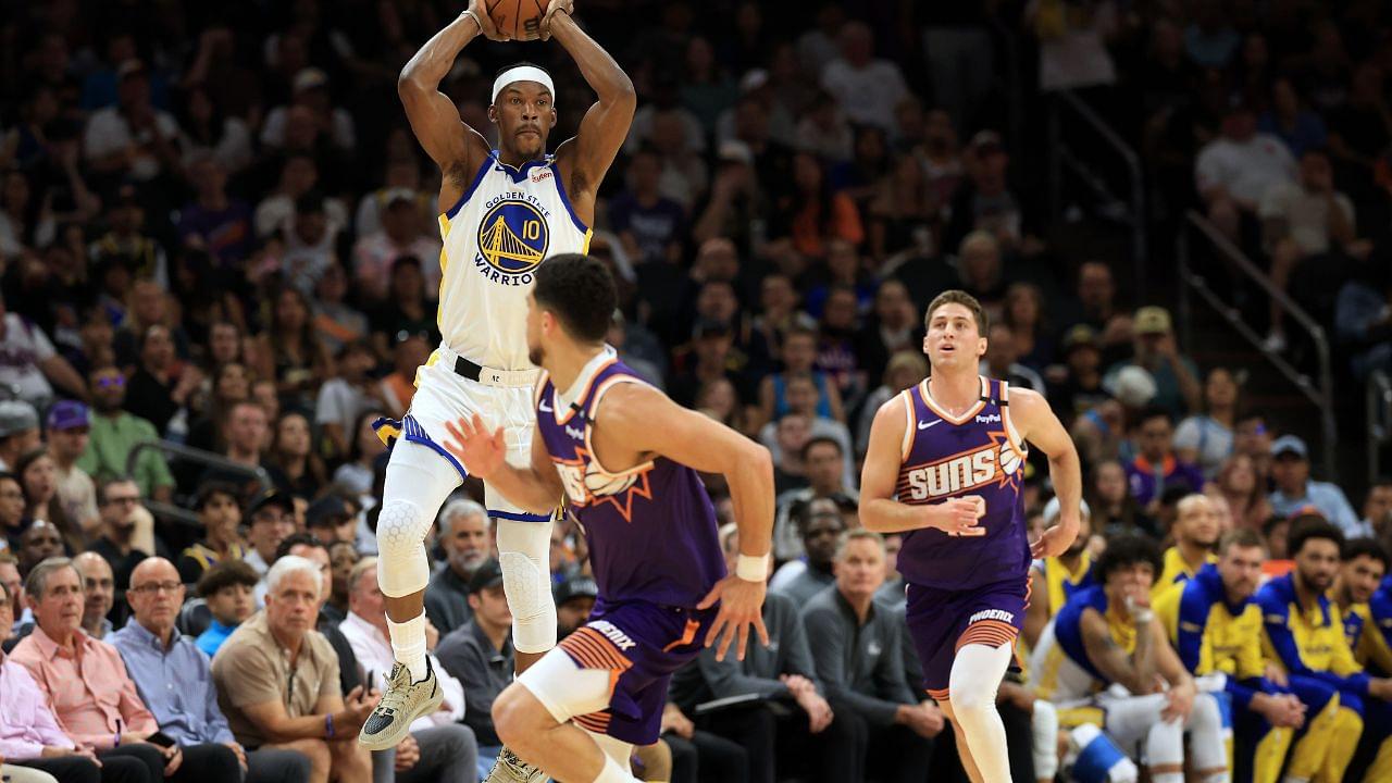Golden State Warriors forward Jimmy Butler III (10) makes a pass in front of Phoenix Suns guard Devin Booker (1) during the first half at Footprint Center.