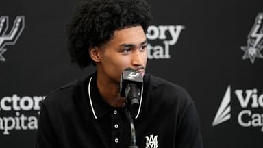 Jun 28, 2025; San Antonio, TX, USA; San Antonio Spurs first round draft pick Dylan Harper answers questions during press conference at Victory Capital Performance Center.