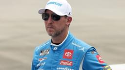NASCAR Cup Series driver Denny Hamlin stands on pit road prior to the Autotrader EchoPark Automotive 400 at Dover Motor Speedway.