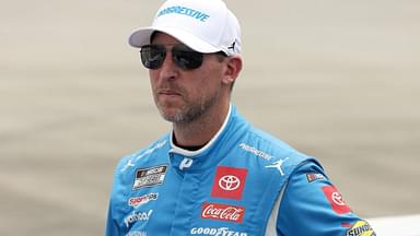 NASCAR Cup Series driver Denny Hamlin stands on pit road prior to the Autotrader EchoPark Automotive 400 at Dover Motor Speedway.