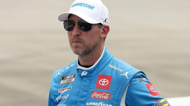 NASCAR Cup Series driver Denny Hamlin stands on pit road prior to the Autotrader EchoPark Automotive 400 at Dover Motor Speedway.
