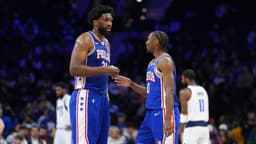 Philadelphia 76ers center Joel Embiid (21) reacts with guard Tyrese Maxey (0) against the Dallas Mavericks in the second quarter at Wells Fargo Center.