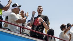 Oklahoma City Thunder player Isaiah Hartenstein yells at fans during the 2025 NBA Oklahoma City Thunder championship parade.