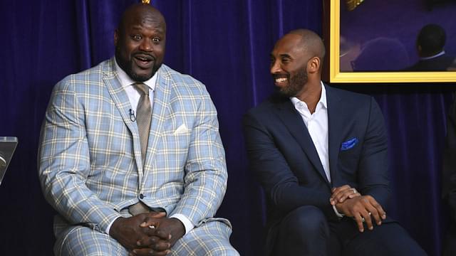 Los Angeles Lakers former center Shaquille O'Neal (left) and guard Kobe Bryant react during ceremony to unveil statue of O'Neal at Staples Center.