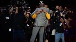 Los Angeles Lakers forward Kobe Bryant (facing camera) hugs former Laker player Magic Johnson before a game against the Utah Jazz at Staples Center.
